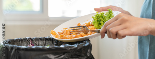 Wallpaper Mural Compost from leftover food in the meal in household, female hand holding left over meal use fork scraping waste, rotten vegetable throwing away into garbage, trash or bin. Environmentally responsible Torontodigital.ca