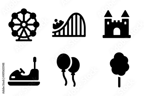 Funfair attractions with a ferris wheel, roller coaster, and castle at an amusement park during the day
