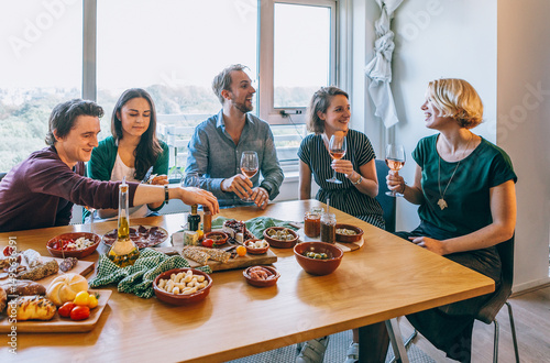 Friends enjoying wine and appetizers at a casual get-together