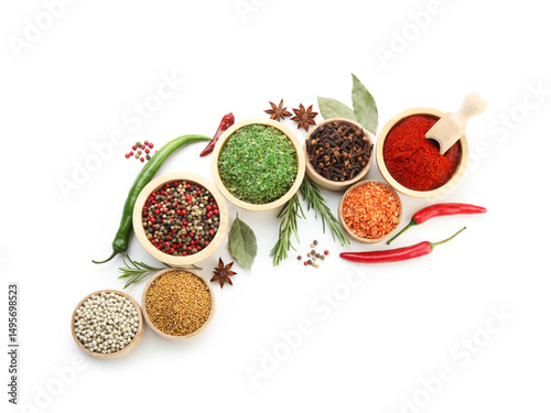 Fototapeta Naklejka Na Ścianę i Meble -  Different aromatic spices isolated on white, top view