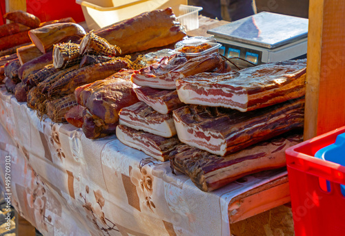 Organic homemade cured dry bacon sold on a local market stall