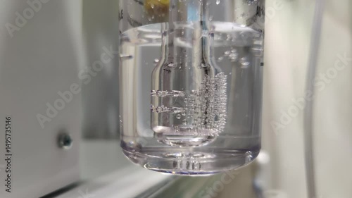 Close-up footage of the oxygen tank used in oxygen therapy in hospital room.