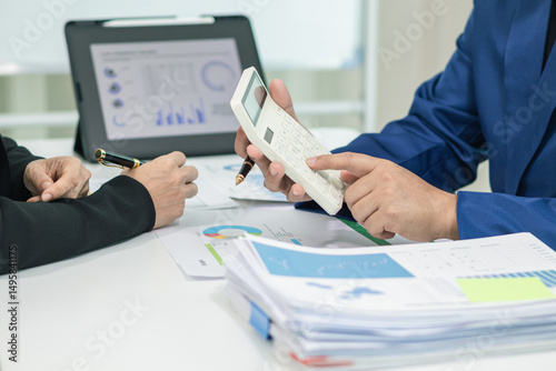 Businesswoman talking to business consultant to make decision on new business investment to make more productive and consultant also give advice on statistics on customer demand including good profit.