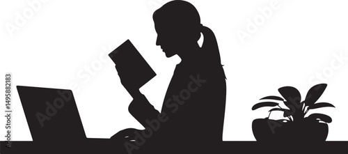 Woman Reading Book at Desk with Laptop and Plant