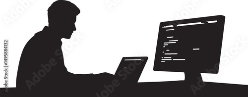 Silhouette of a Programmer Working on Laptop and Desktop Computer