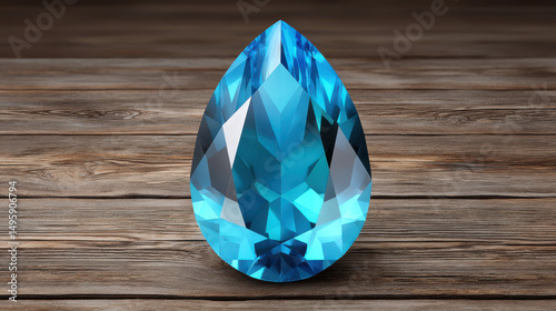 A brilliantly cut pear shaped blue topaz gemstone sparkles beautifully as it rests on a rustic wooden surface with a weathered and textured appearance creating depth.