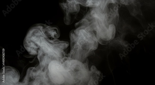 Mystical swirling smoke on dark background for creative design