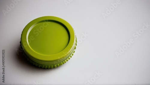 Green mockup cap on a neutral background, perfect for branding and packaging designs.
