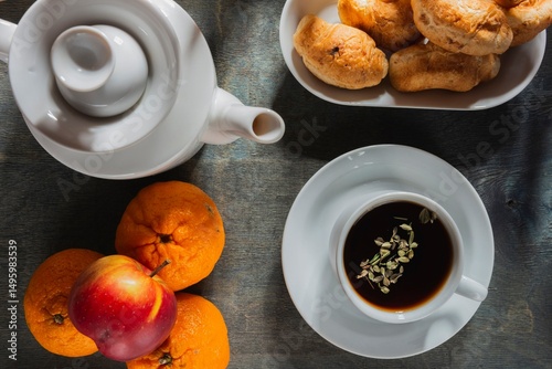 Morning breakfast - tea and light snack on a background dark