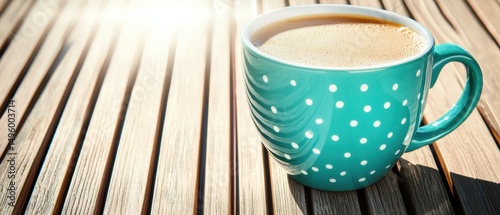 A cup of coffee on a wooden table.