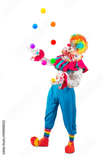 Funny juggler clown juggling balls in the circus, man entertainer as Joker in a suit and wig, with clown whiteface makeup. Trickster, jester, pantomime, mime, and a professional actor at events