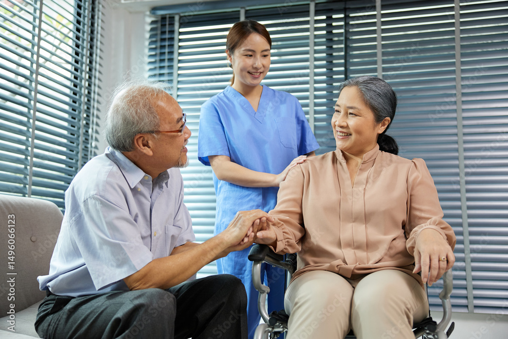 nurse or caregiver helping senior woman sitting on wheelchair and senior man support her at home nurse or caregiver helping senior woman sitting on wheelchair and senior man support her at home