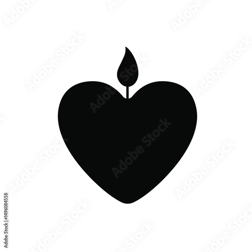 Heart shaped candle burning brightly love symbol