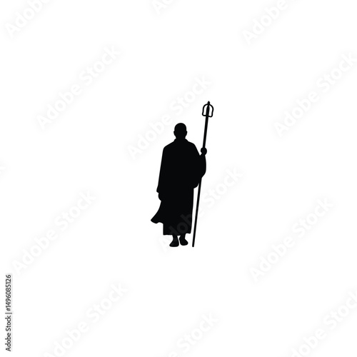Monk silhouette holding a staff spiritual peace