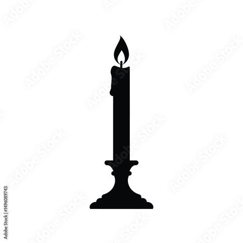 Single lit candle in candlestick silhouette
