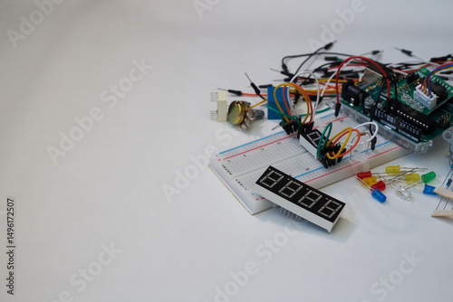 Assorted electronic components and microcontroller on breadboard with wires and LEDs