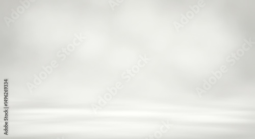 Blank, neutral, grey studio backdrop.  Soft, diffused light creates a clean, empty space for product presentation