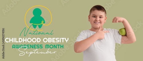Overweight boy with apple o...