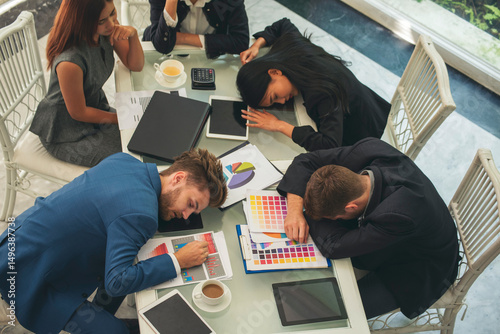 Recession Stress business teams meeting work hard at home office headache, depressed from failure over burdened. Tired Asian team business people despair stress overworked pain problems frustration