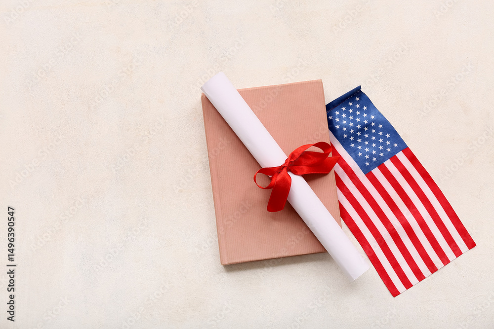 Fototapeta premium Diploma with red ribbon, USA flag and book on white grunge background