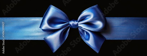 Shiny smooth blue satin ribbon tied into a neat bow against a black background, evoking elegance and celebration
