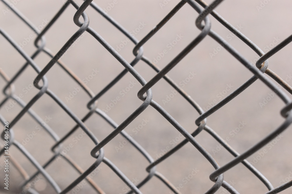 Fototapeta premium old wire mesh on dirty wall, construction industry