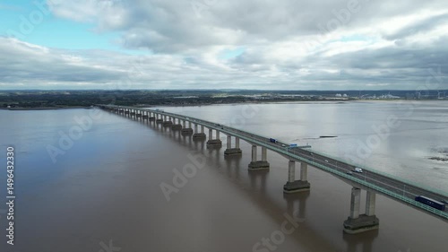 Wallpaper Mural Amazing aerial footage of vehicles driving on highway bridge over sea bay. Tracking of passing truck. Prince of Wales Bridge, Wales, UK Torontodigital.ca