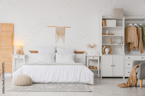 Interior of light bedroom w...