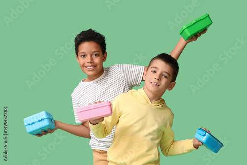 Cute boys with lunchboxes o...