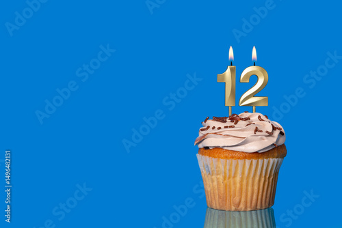 Birthday Or Anniversary Cupcake with Lit Candle; Number 12 Candle.