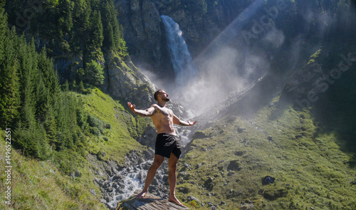 Man, breathing and relax with peace in nature. Meditation, spiritual wellness. Calm, athlete and freedom in environment. Training mindfulness. Relaxed man in nature. Freedom and happiness lifestyle.