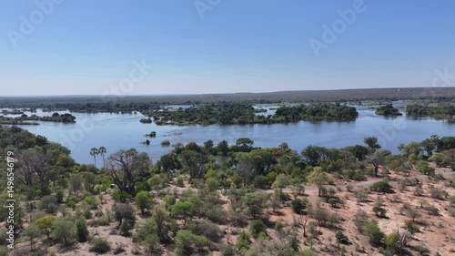 Wallpaper Mural Zambezi River In Victoria Falls Matabeleland North Zimbabwe. Aerial View Of A River Surrounded By Lush Green Tropical Rainforest. Leisure Forest Flowing Beautiful. Flowing Tropical Landscape. Torontodigital.ca