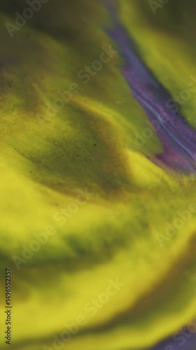 Vertical video. Yellow grunge. Acrylic fluid. Wavy flow ink mix with interpenetration paint. Art diffusion of colored liquid deformation contrasting s. photo