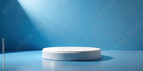 White circular pedestal on a blue background with light shining down
