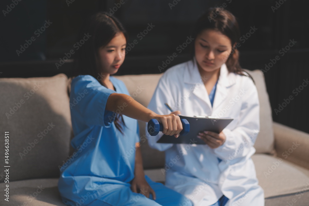 Fototapeta premium Unrecognizable uses blue hand weight during physical therapy session