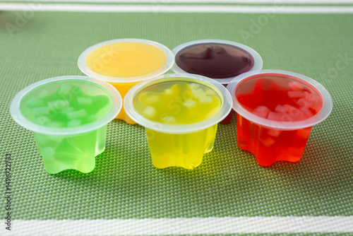 A view of some opened fruit jelly cups.