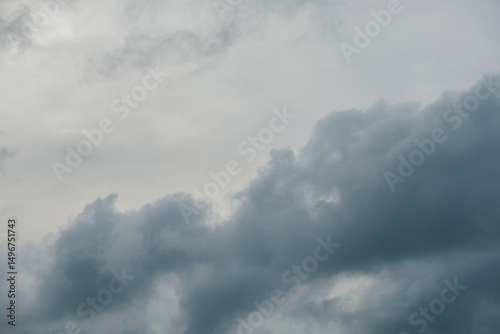 Overcast sky with thick gray clouds during late afternoon, creating a moody and dramatic atmosphere. Perfect for weather themes, storm backgrounds, or environmental and nature concepts.