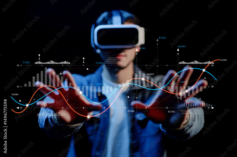 Fototapeta premium Young man wearing virtual reality headset interacting with digital data visualizations against a dark background in a modern technological environment