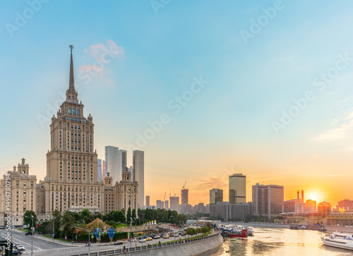 High-rise stalinist building near river at summer sunset in Moscow, Russia. Historic name is Hotel Ukraine.