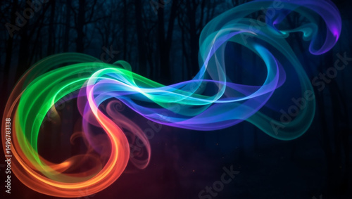Abstract colored smoke trails swirling against a dark background creating a dynamic effect