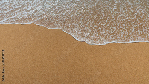 Fototapeta Naklejka Na Ścianę i Meble -  Soft sea wave on the sandy beach, natural background