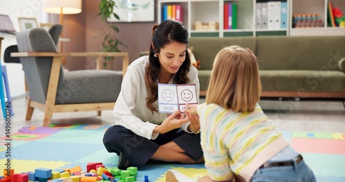 Woman, therapist and child with visual lesson for private tutoring or assessment at therapy office. Female person, psychologist or academic practice with pictures for education or learning difficulty