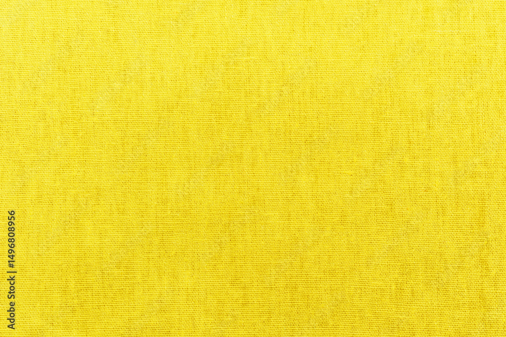 Obraz premium Bright yellow fabric linen texture background