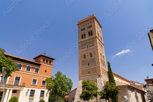 San Martin Tower rising over Teruel cityscape in Plaza Perez Prado, Spain photo