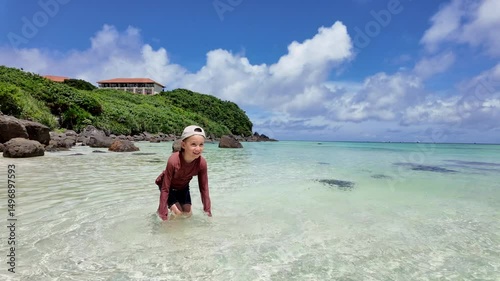 Joyful Child Splashing Water In Slow Motion On A Sunny Tropical Beach, Fun Summer Vacation Moment