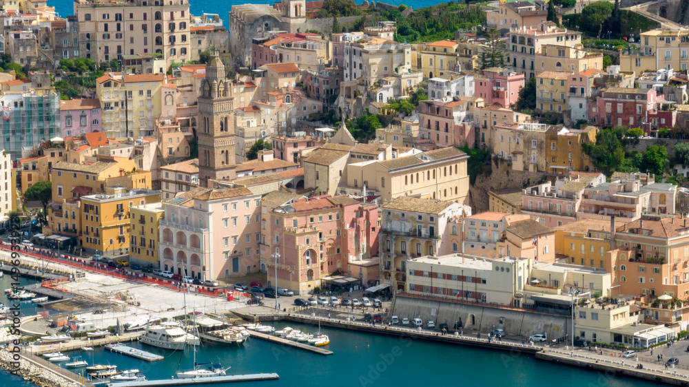 Obraz premium Aerial view of houses and buildings in the historic center of the town of Gaeta. It is located in the province of Latina, Lazio, Italy. The apartments overlook the Mediterranean Sea.