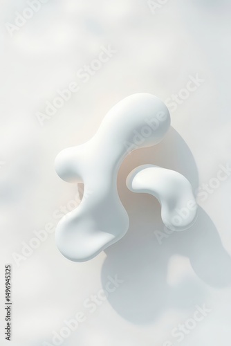 Unique abstract shapes made of soft white material resting on a smooth surface in natural light