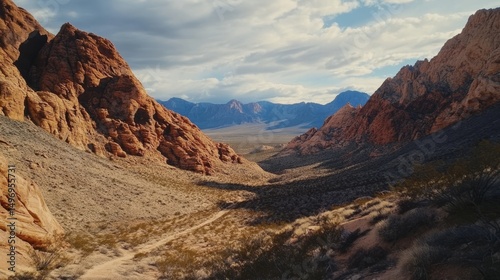 A desert scene with red rock canyons. It shows the beautiful, rocky landscape.
