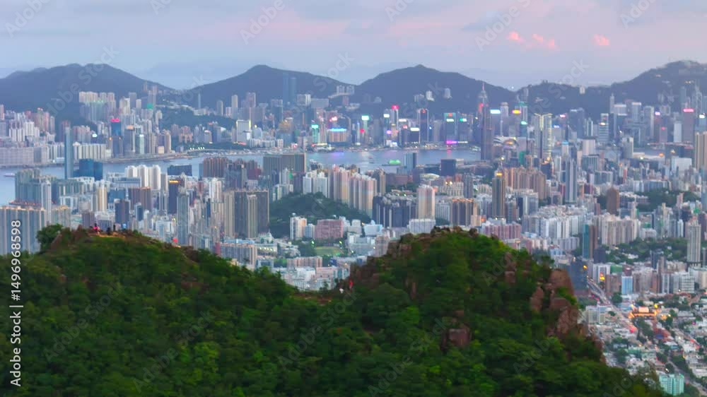 Cityscape view from mountain peak at dusk. Urban skyline meets nature with soft light and distant buildings fading into the twilight sky. Cityscape view from mountain peak at dusk. Urban skyline meets nature with soft light and distant buildings fading into the twilight sky.