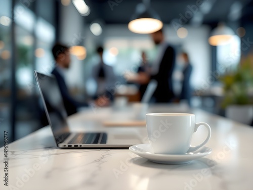 White coffee cup with laptop computer on office table for business concept, in clean office.